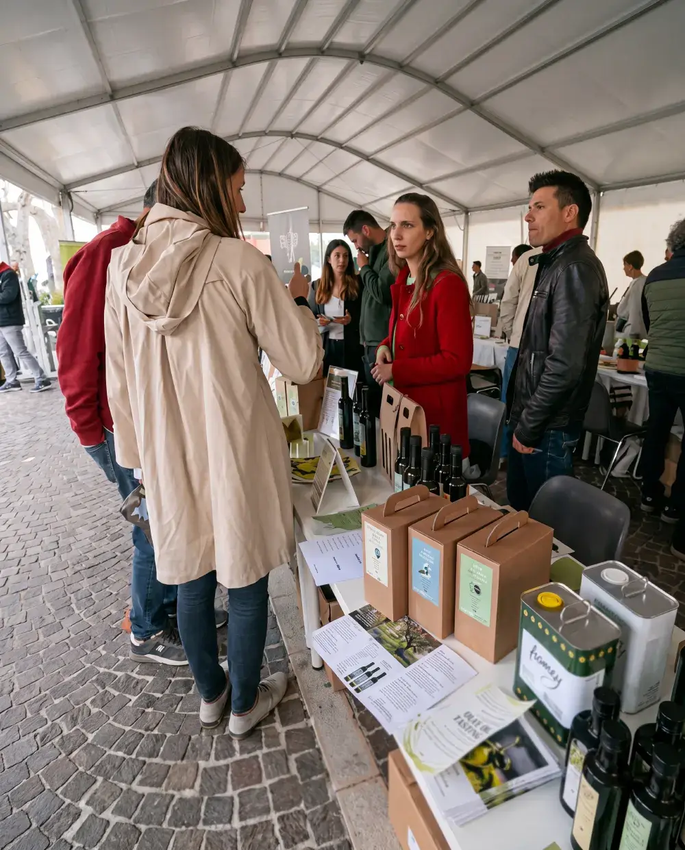 Visitors at the Ver Zen oil mill stand at the Torri del Benaco Olive Oil Festival